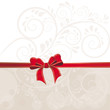 Hintergrund aus Ornamenten und roter Schleife
