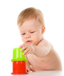 child playing with color pyramid toy. isolated on white