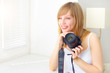 Teenage girl with digital camera