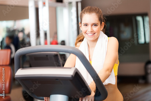 Photo: Woman training in a fitness club Woman training in a fitness club