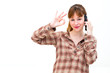 woman with phone and ok gesture