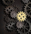 rusty gears and cogs with gold one