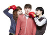 Teenage siblings fighting with boxing gloves