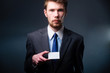 Business man handing a blank business card
