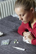 Sick young woman with medicine