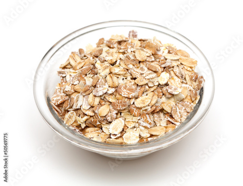 Photo: oat flakes in a glass bowl oat flakes in a glass bowl