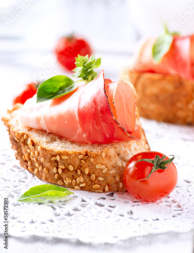 Photo: Jamon. Slices of Bread with Spanish Serrano Ham Served as Tapas Jamon. Slices of Bread with Spanish Serrano Ham Served as Tapas
