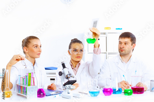 Photo: Team of scientists working in laboratory Team of scientists working in laboratory