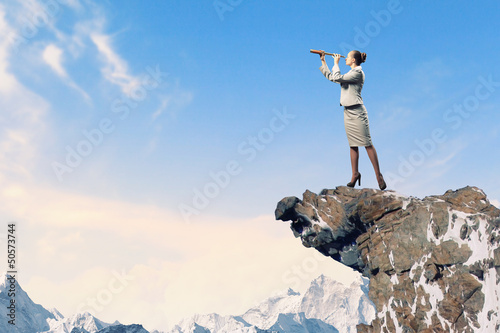 Photo: Business woman with telescope Business woman with telescope