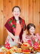 Women  eating pancake with caviare