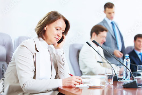 Photo: Four businesspeople at meeting Four businesspeople at meeting