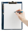 Hand writing on en empty document in a clipbard isolated