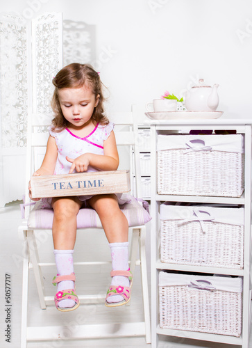 Photo: Little girl holding wooden box Little girl holding wooden box