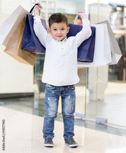 Photo: Boy holding shopping bags Boy holding shopping bags