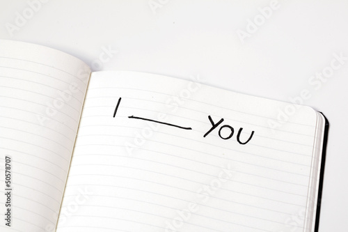 Photo: Notebook with words i love you, express emotions, isolated Notebook with words i love you, express emotions, isolated