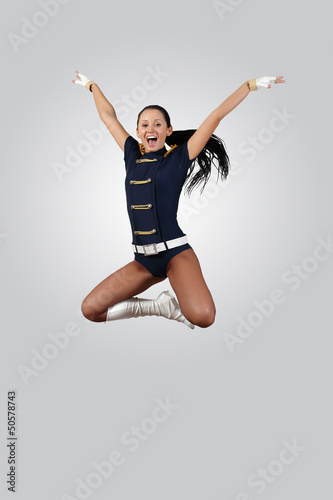 Photo: Young female dancer against white background Young female dancer against white background