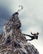 businessman climbing mountain