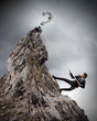 businessman climbing mountain