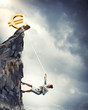 businesswoman climbing mountain