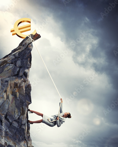 Photo: businesswoman climbing mountain businesswoman climbing mountain