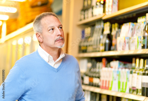 Photo: Man shopping at the supermarket Man shopping at the supermarket