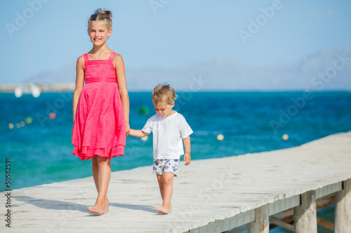 Photo: Kids walking on jetty Kids walking on jetty