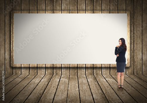 Photo: Business woman near billboard. Business woman near billboard.