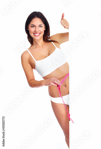 Photo: Beautiful healthy woman with a measuring tape. Beautiful healthy woman with a measuring tape.