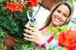 Woman cutting flower.