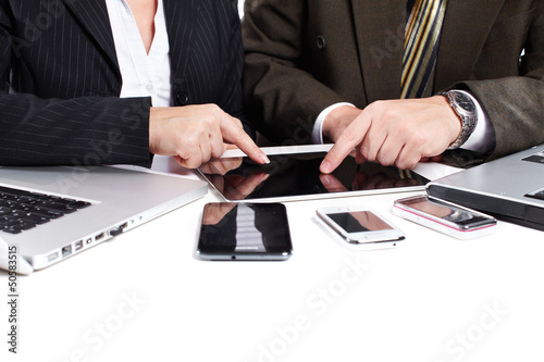 Photo: Business people group working with laptop. Business people group working with laptop.