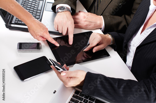 Photo: Business people group working with laptop. Business people group working with laptop.