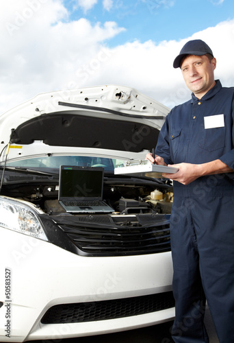 Photo: Professional auto mechanic. Professional auto mechanic.