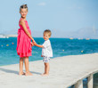 Kids walking on jetty