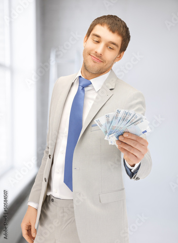 Photo: man with euro cash money man with euro cash money