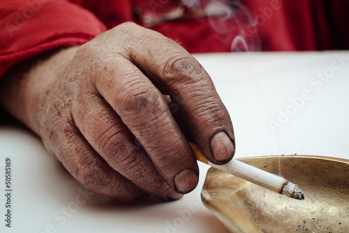 Photo: Dirty hand with cigarette Dirty hand with cigarette