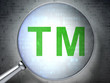 Law concept:  Trademark with optical glass