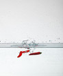 Chili peppers fall in the water