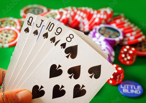 Photo: Card for poker in the hand, chips and card for poker Card for poker in the hand, chips and card for poker
