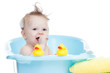 adorable baby having bath in blue tub
