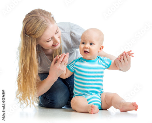 Photo: loving mother holding baby boy isolated on white loving mother holding baby boy isolated on white