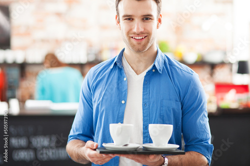 Photo: Waiter with coffee on tray Waiter with coffee on tray