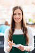 Portrait of waitress in cafe