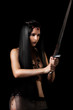 Young sexy woman warrior with sword