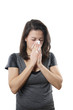 young woman blowing nose with paper tissue