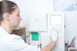 Woman performin hematological test.