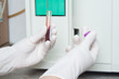Woman performin hematological test.
