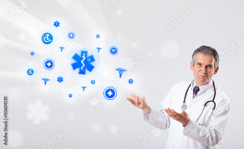 Photo: Doctor with blue medical icons Doctor with blue medical icons