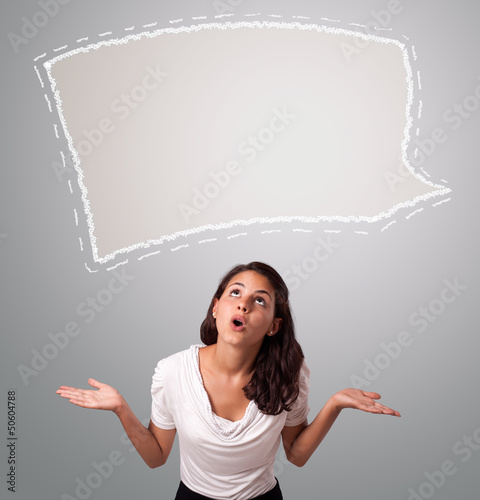Photo: Attractive woman looking abstract speech bubble copy space Attractive woman looking abstract speech bubble copy space