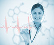 Doctor holding stethoscope up to red ECG line