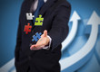 Businessman with digital puzzles